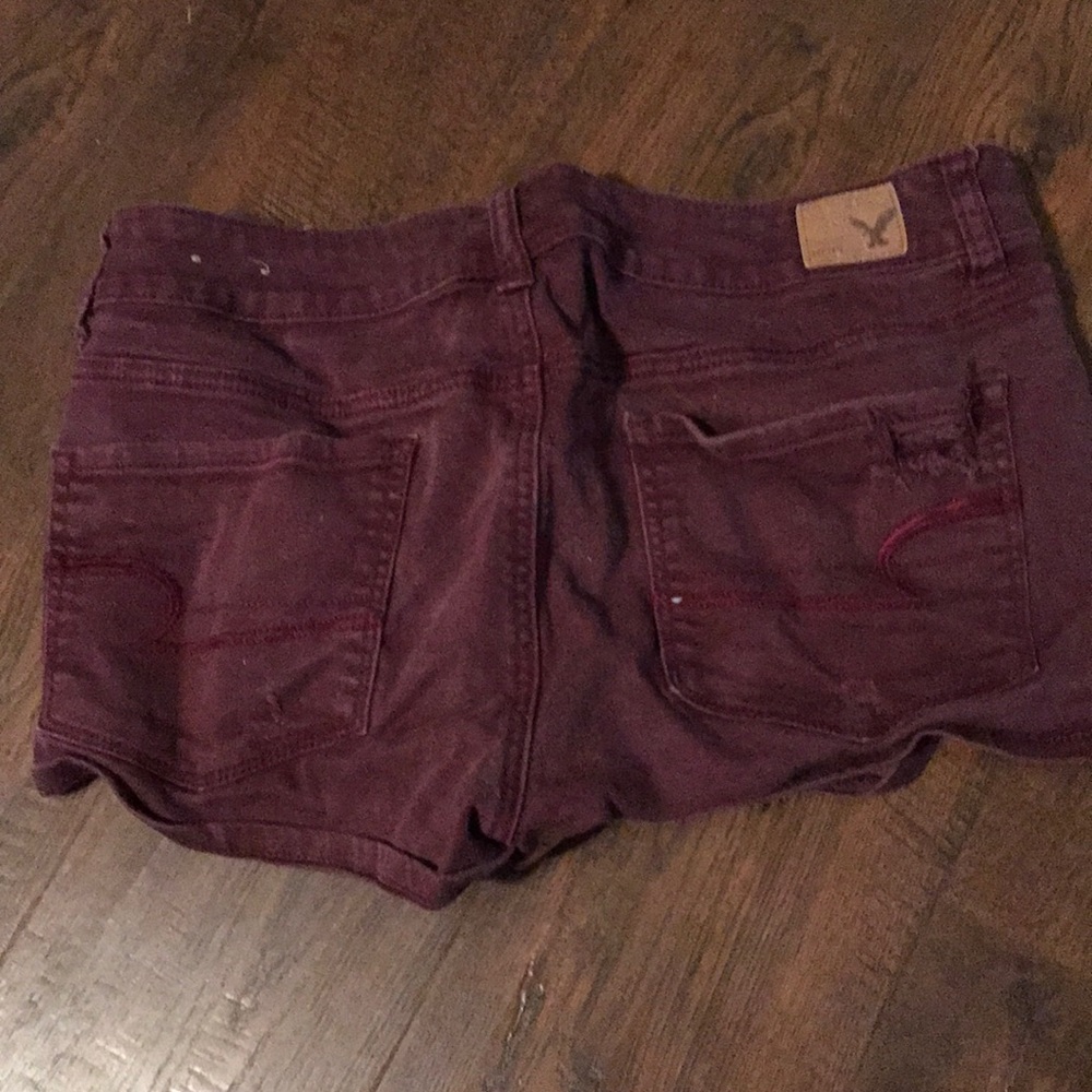 Red ripped shorts American eagle